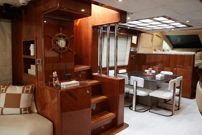  Yacht Photos Pics Luxurious interior of 2013 Gulf Craft Majesty 86 yacht with elegant dining area and wooden finishes.