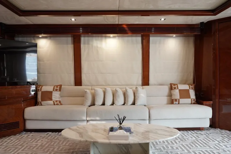  Yacht Photos Pics Luxurious interior of 2013 Gulf Craft Majesty 86 yacht with elegant sofa and marble table.