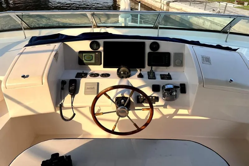  Yacht Photos Pics Cockpit of 2013 Gulf Craft Majesty 86 yacht with steering wheel and navigation controls.
