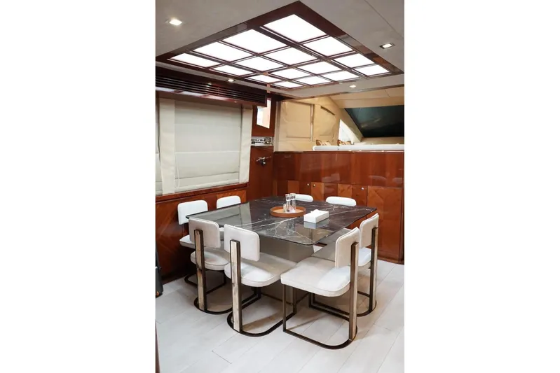  Yacht Photos Pics Luxurious dining area on 2013 Gulf Craft Majesty 86 yacht with modern decor.