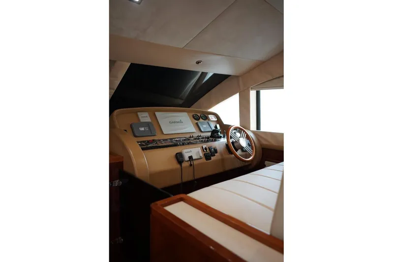  Yacht Photos Pics Helm of 2013 Gulf Craft Majesty 86 yacht with steering wheel and navigation controls.