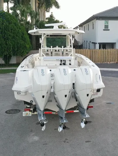  Yacht Photos Pics 2021 Boston Whaler 350 Outrage with triple outboard engines.