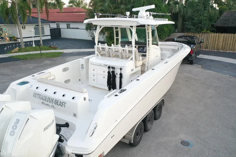  Yacht Photos Pics 2021 Boston Whaler 350 Outrage boat docked, rear view, with triple Mercury engines.