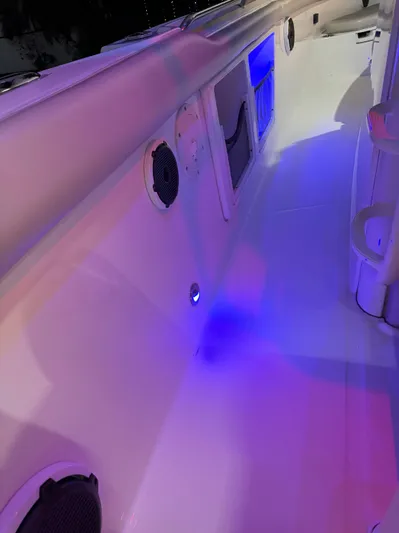  Yacht Photos Pics 2021 Boston Whaler 350 Outrage boat interior with blue LED lighting.