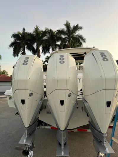  Yacht Photos Pics 2021 Boston Whaler 350 Outrage with triple outboard engines.