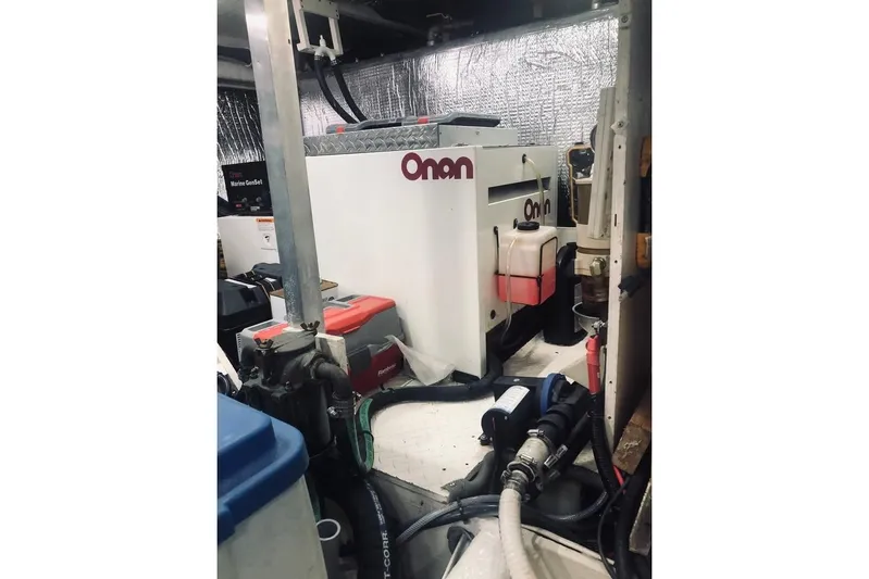  Yacht Photos Pics Engine room of 2001 Cruisers Yachts 5000 Pilothouse with Onan generator.