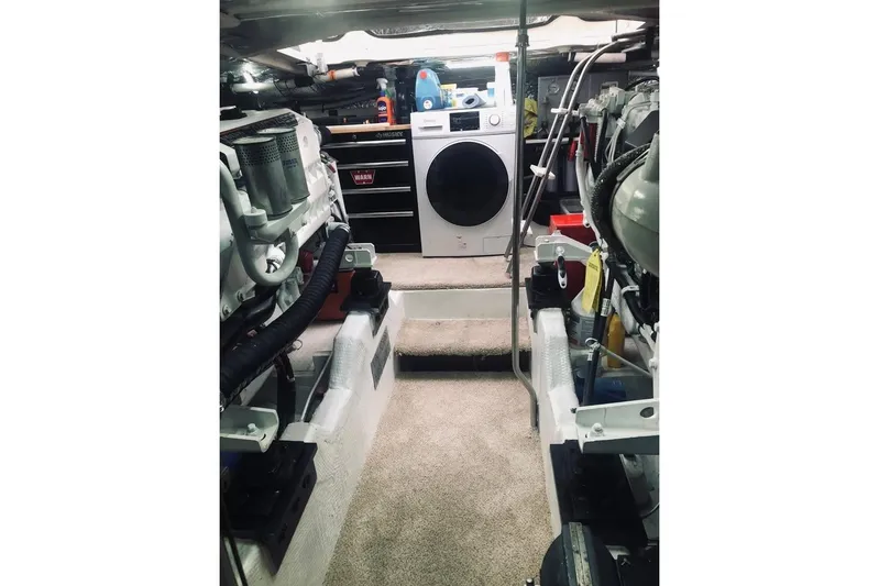  Yacht Photos Pics Engine room of 2001 Cruisers Yachts 5000 Pilothouse with washer and tools.