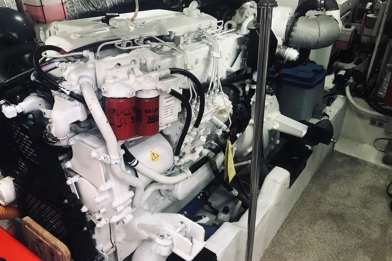  Yacht Photos Pics Engine room of 2001 Cruisers Yachts 5000 Pilothouse, showcasing detailed machinery components.