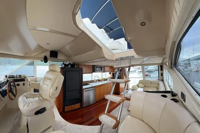  Yacht Photos Pics Luxurious interior of 2001 Cruisers Yachts 5000 Pilothouse with modern amenities and elegant design.