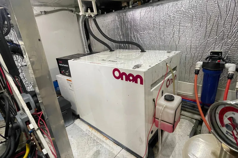  Yacht Photos Pics Engine room of 2001 Cruisers Yachts 5000 Pilothouse with Onan generator.