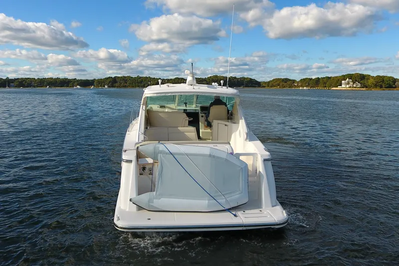 Ost - 39044 Yacht Photos Pics 2008 Tiara Yachts 3900 Sovran on calm water under a blue sky.