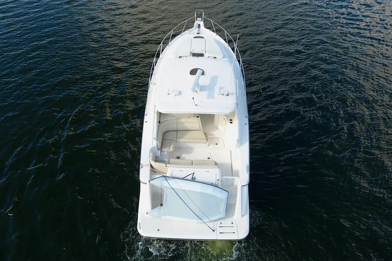 Ost - 39044 Yacht Photos Pics 2008 Tiara Yachts 3900 Sovran cruising on open water, aerial view.