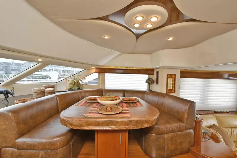 Chirstina Maria Yacht Photos Pics Luxurious interior of 2009 Silverton 52 Ovation yacht with elegant dining area and modern lighting.