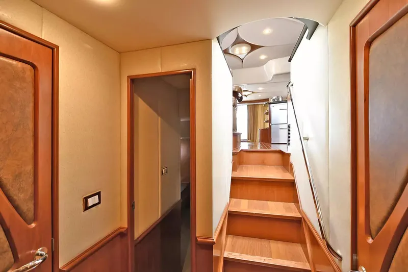 Chirstina Maria Yacht Photos Pics Interior of 2009 Silverton 52 Ovation yacht, featuring wooden stairs and elegant design.