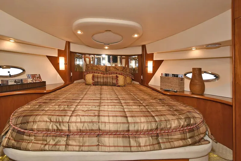 Chirstina Maria Yacht Photos Pics Luxurious bedroom interior of 2009 Silverton 52 Ovation yacht with elegant decor.