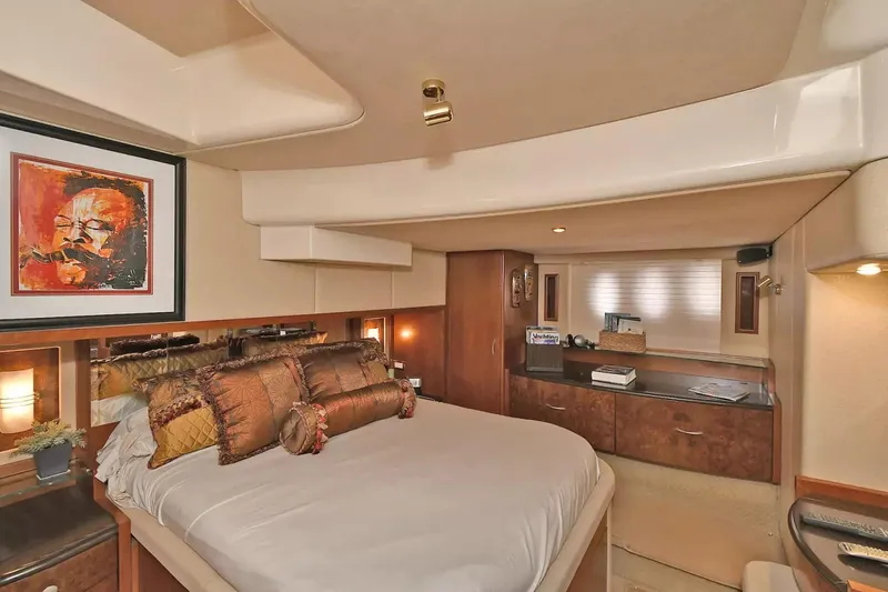 Chirstina Maria Yacht Photos Pics Luxurious bedroom interior of 2009 Silverton 52 Ovation yacht with elegant decor and artwork.