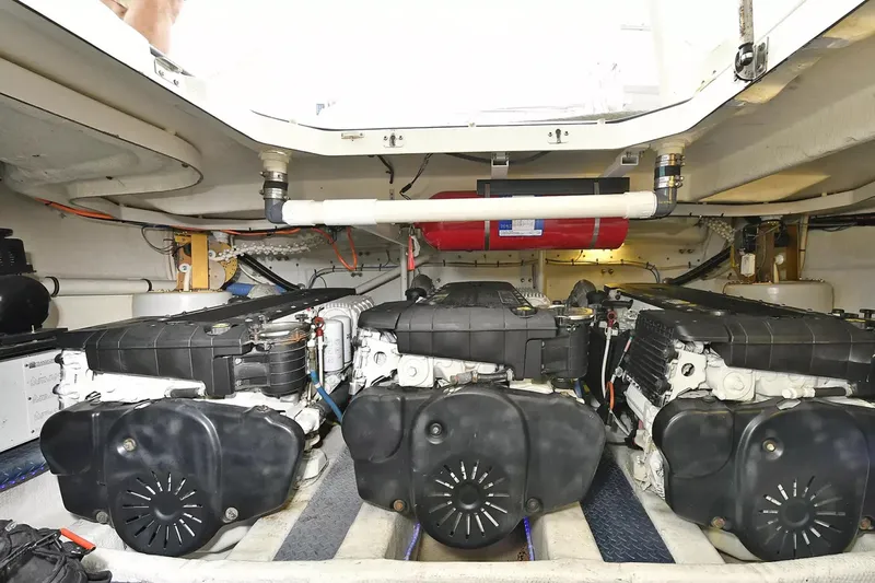 Chirstina Maria Yacht Photos Pics Engine room of 2009 Silverton 52 Ovation yacht, showcasing dual engines and mechanical components.