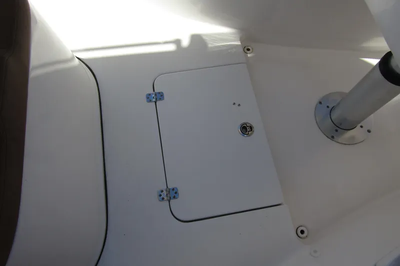  Yacht Photos Pics 2025 Sea Pro 322 Offshore boat interior with storage hatch and metal support pole.
