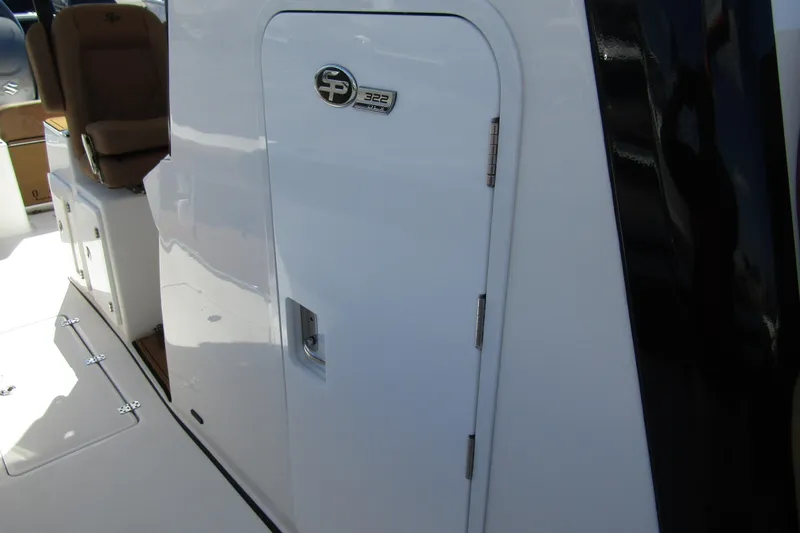  Yacht Photos Pics 2025 Sea Pro 322 Offshore boat interior with seating and storage compartment.