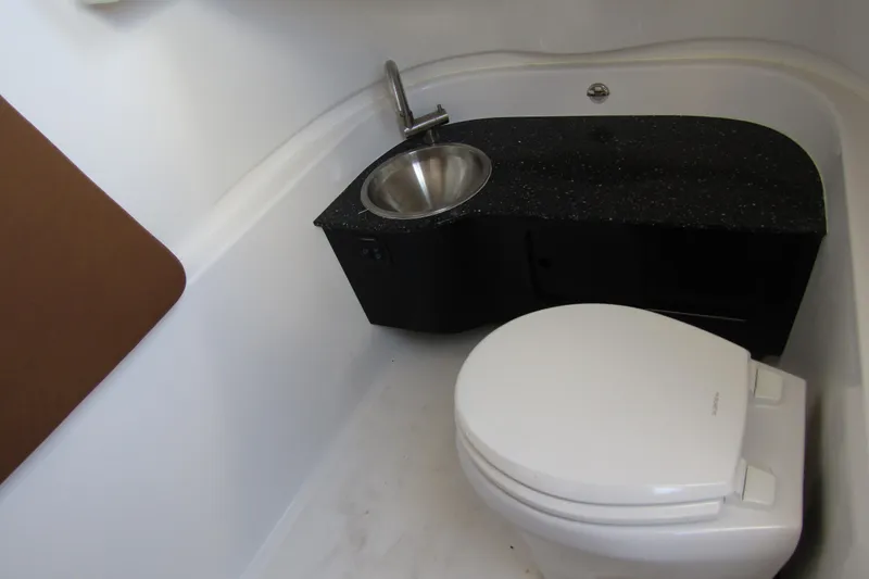  Yacht Photos Pics 2025 Sea Pro 322 Offshore boat bathroom with toilet and sink.