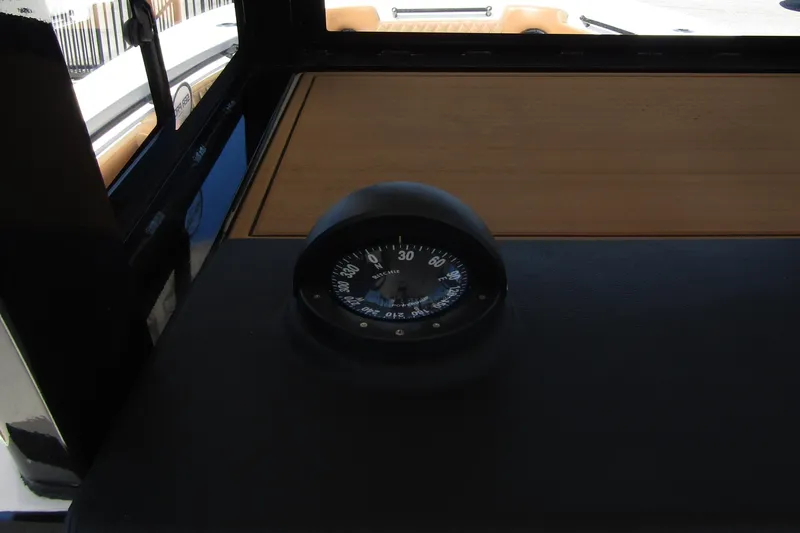  Yacht Photos Pics Compass on 2025 Sea Pro 322 Offshore boat dashboard, showcasing navigation equipment.