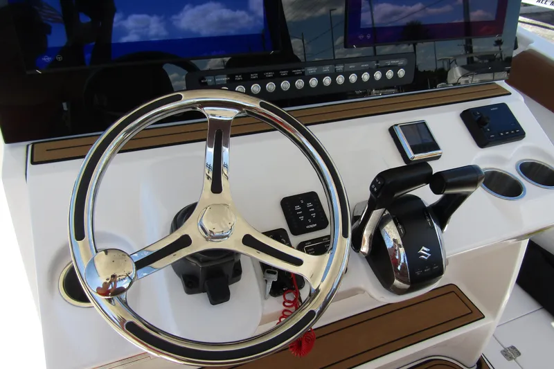  Yacht Photos Pics Helm of 2025 Sea Pro 322 Offshore boat with modern controls and steering wheel.