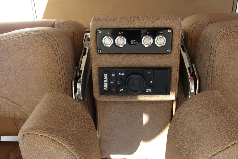  Yacht Photos Pics 2025 Sea Pro 322 Offshore boat seat controls and Simrad navigation system.