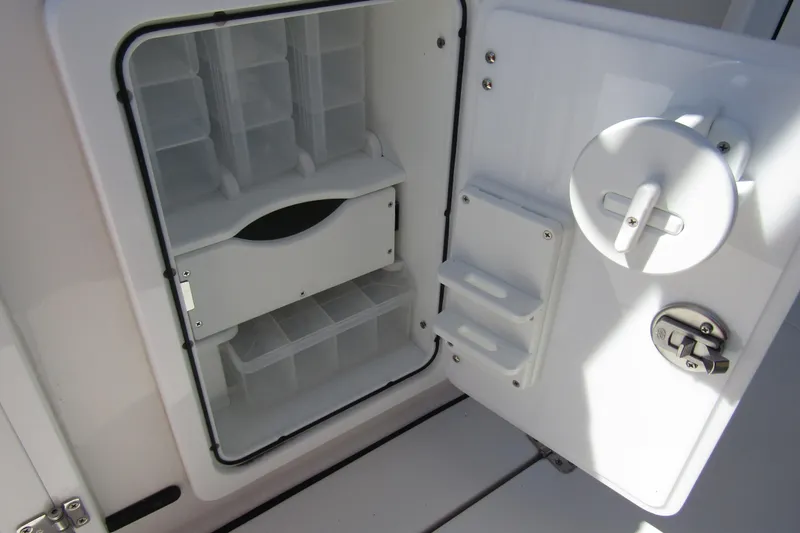  Yacht Photos Pics Open storage compartment on 2025 Sea Pro 322 Offshore boat, featuring organized shelves and secure latch.