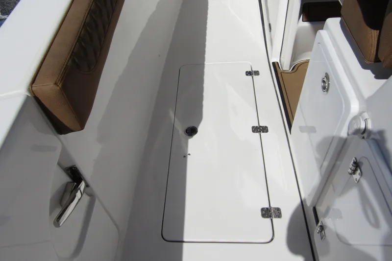  Yacht Photos Pics 2025 Sea Pro 322 Offshore boat deck with storage compartment and cushioned seating.