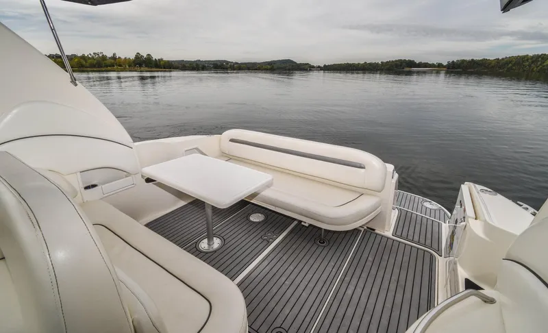  Yacht Photos Pics 2005 Sea Ray 360 Sundancer boat with seating area on calm water.