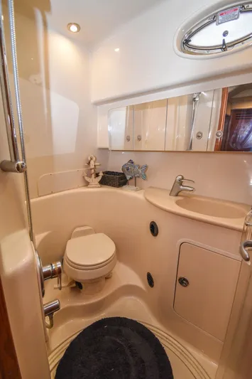  Yacht Photos Pics 2005 Sea Ray 360 Sundancer bathroom with modern fixtures and compact design.
