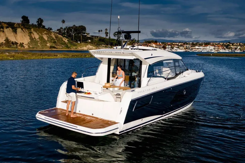  Yacht Photos Pics Manufacturer Provided Image: 2023 Prestige 420 S yacht cruising on a scenic waterway.