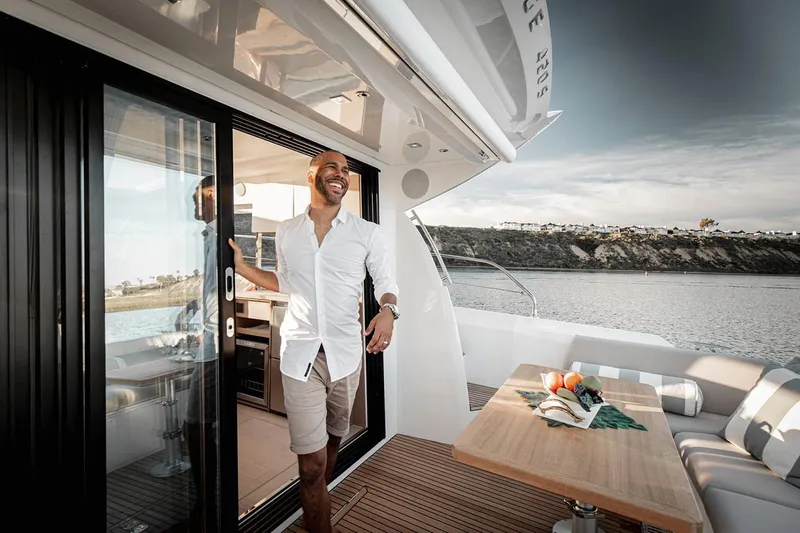  Yacht Photos Pics Manufacturer Provided Image: Man enjoying the deck of a 2023 Prestige 420 S yacht.
