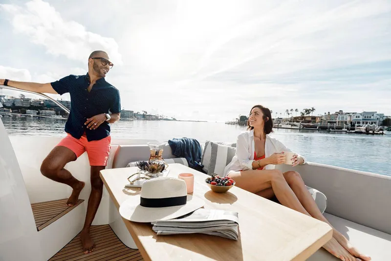  Yacht Photos Pics Manufacturer Provided Image: Couple enjoying a sunny day on a 2023 Prestige 420 S yacht.