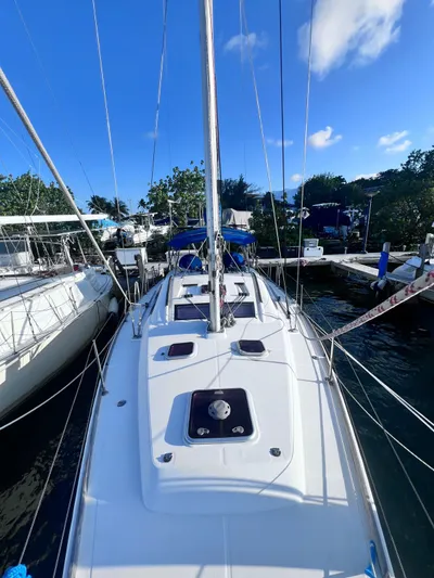  Yacht Photos Pics 2009 Beneteau America Oceanis 41 sailboat docked at a marina on a sunny day.