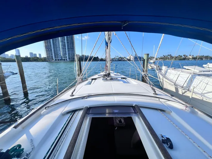  Yacht Photos Pics Beneteau America Oceanis 41 sailboat docked, 2009 model, with cityscape in the background.