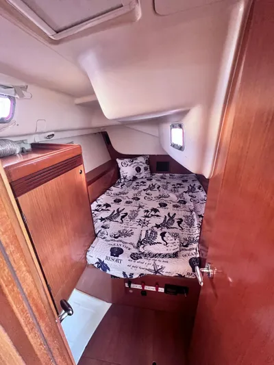  Yacht Photos Pics 2009 Beneteau Oceanis 41 cabin interior with nautical-themed bedding.