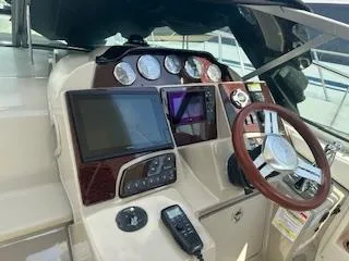Hanky Panky Yacht Photos Pics 2012 Sea Ray 350 Sundancer helm with navigation screens and controls.