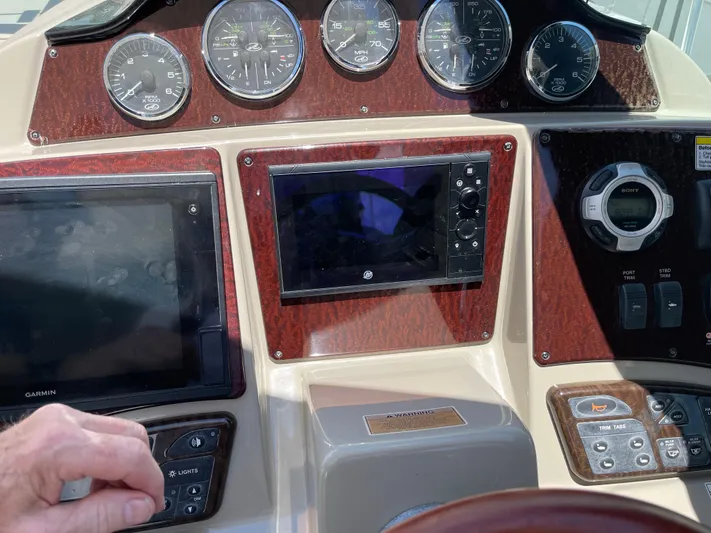 Hanky Panky Yacht Photos Pics Control panel of a 2012 Sea Ray 350 Sundancer boat with navigation instruments.