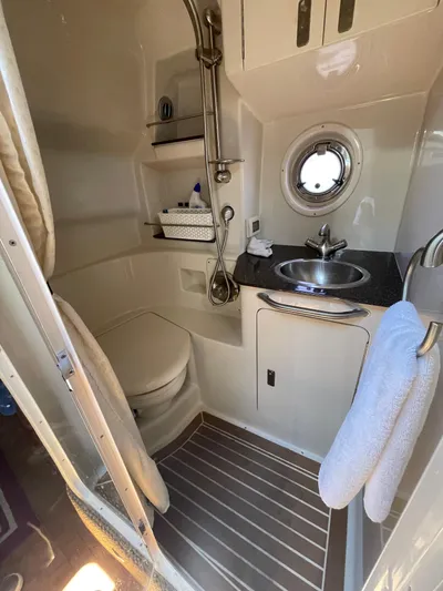 Hanky Panky Yacht Photos Pics Compact bathroom in 2012 Sea Ray 350 Sundancer yacht with sink, toilet, and shower.