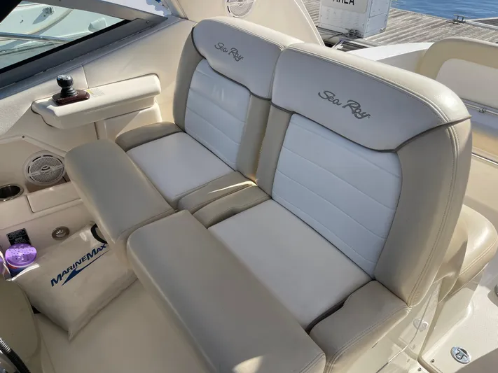 Hanky Panky Yacht Photos Pics 2012 Sea Ray 350 Sundancer cockpit seating with beige upholstery and branded embroidery.