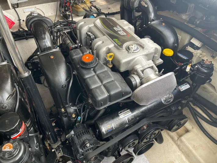 Hanky Panky Yacht Photos Pics Engine compartment of a 2012 Sea Ray 350 Sundancer boat, showcasing detailed components.