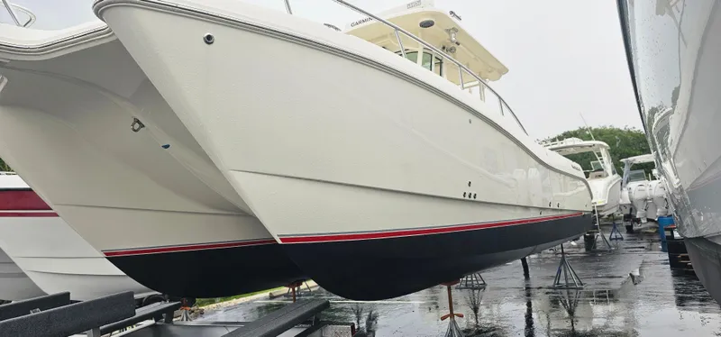  Yacht Photos Pics 2016 World Cat 320 boat on display, white hull with red and blue accents.