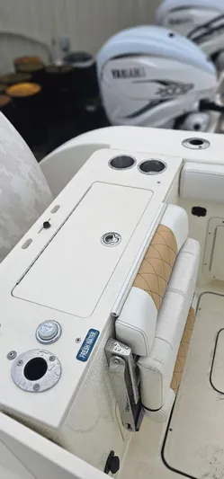  Yacht Photos Pics 2016 World Cat 320 boat interior with Yamaha engines, featuring seating and control panel.