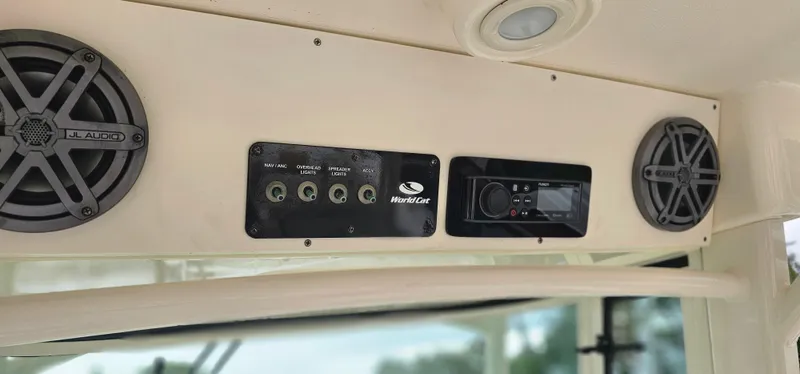  Yacht Photos Pics Control panel and speakers on a 2016 World Cat 320 boat interior.