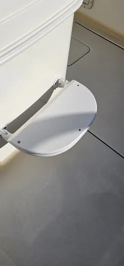  Yacht Photos Pics 2016 World Cat 320 boat step detail, featuring a textured, foldable design for easy access.