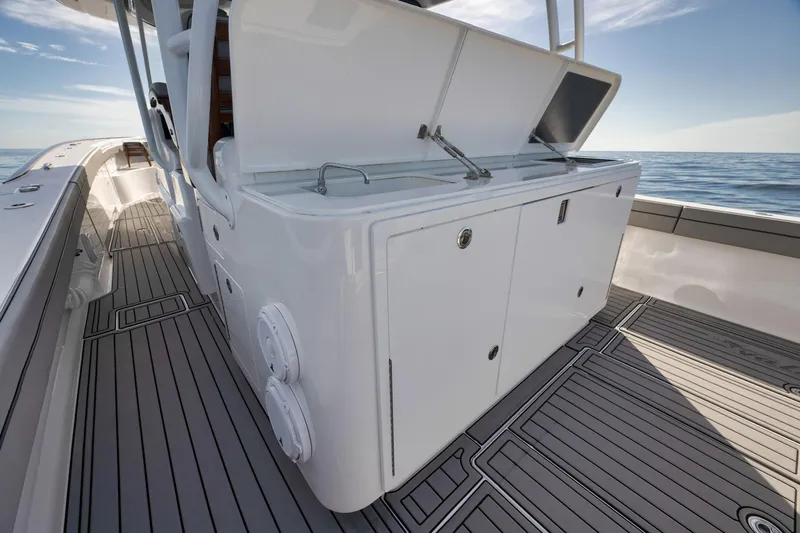  Yacht Photos Pics 2024 Valhalla Boatworks V-46 deck with storage compartments and ocean view.