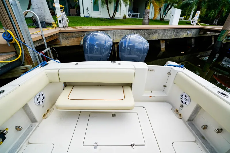 Tender Offer Yacht Photos Pics 2008 Chris-Craft Catalina 29 boat interior with seating and dual engines at dock.