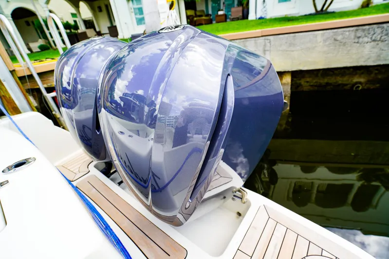 Tender Offer Yacht Photos Pics Twin outboard engines on a 2008 Chris-Craft Catalina 29 boat docked by the water.