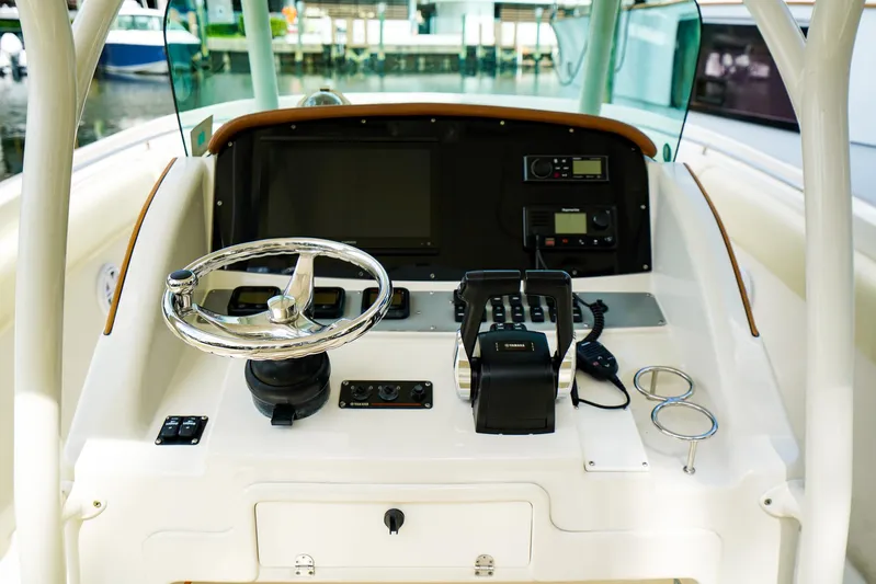 Tender Offer Yacht Photos Pics 2008 Chris-Craft Catalina 29 helm with steering wheel and controls.